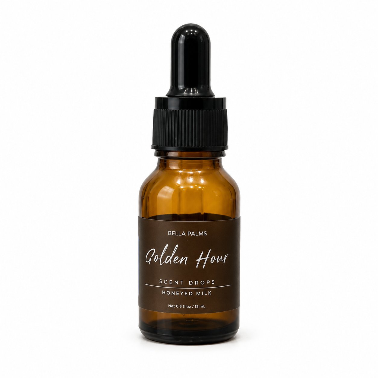 An amber glass dropper bottle of Bella Palms Golden Hour Scent Drops on a clean white background.
