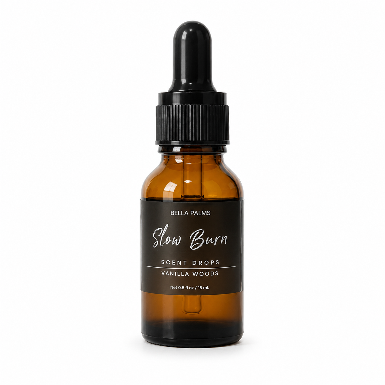 An amber glass dropper bottle of Bella Palms 'Slow Burn' Vanilla Woods scent drops, featuring a black label and black dropper cap, set against a plain white background.