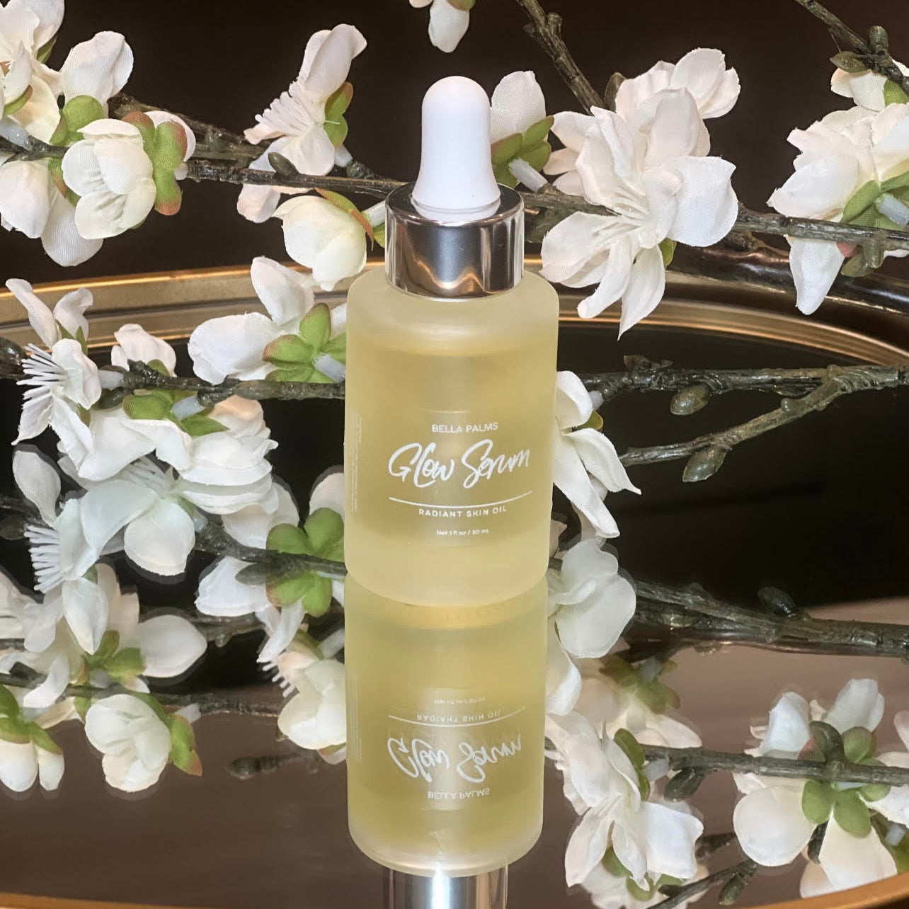 Bella Palms Glow Serum with flowers product view