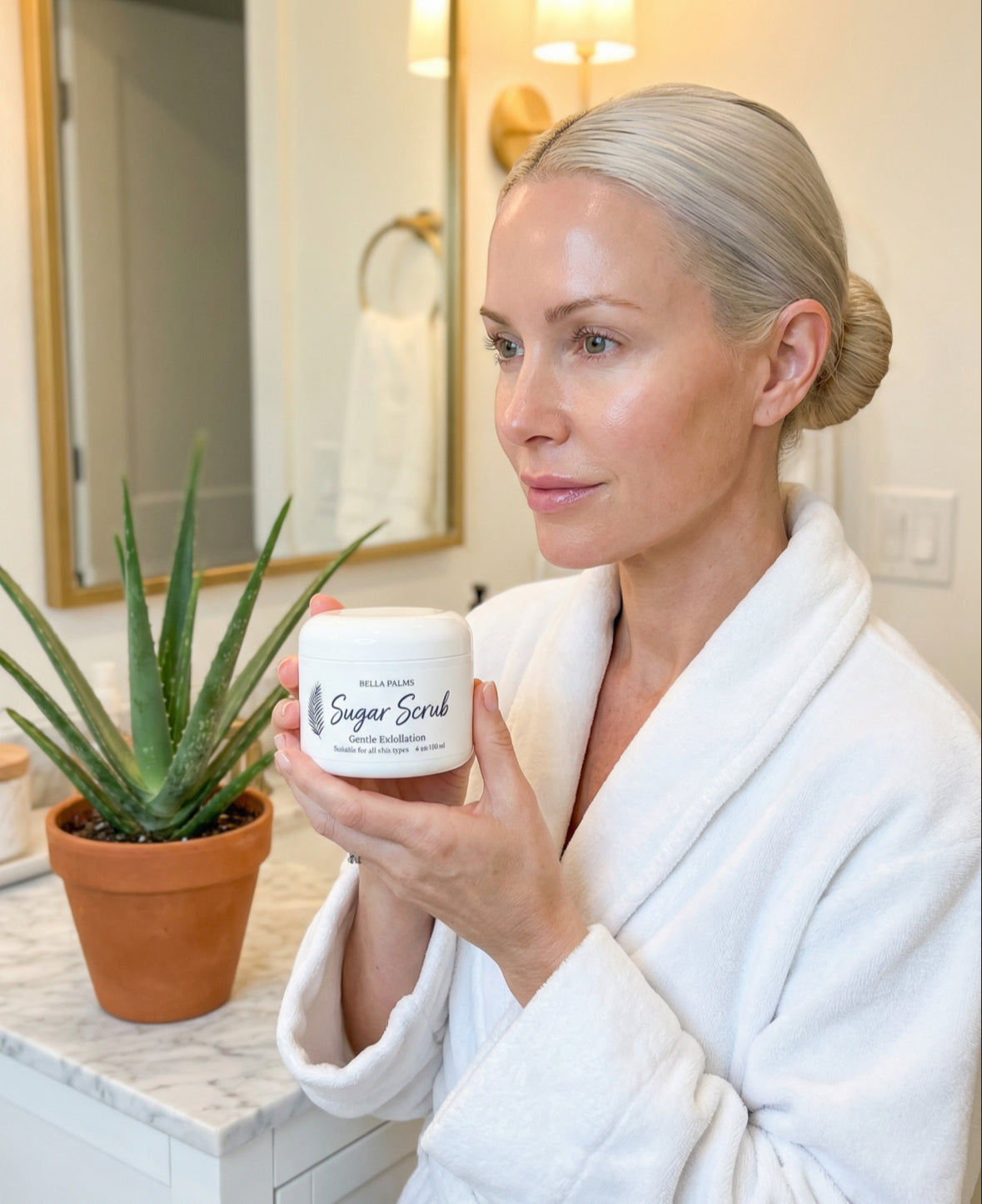 Model holding Bella Palms Sugar Scrub
